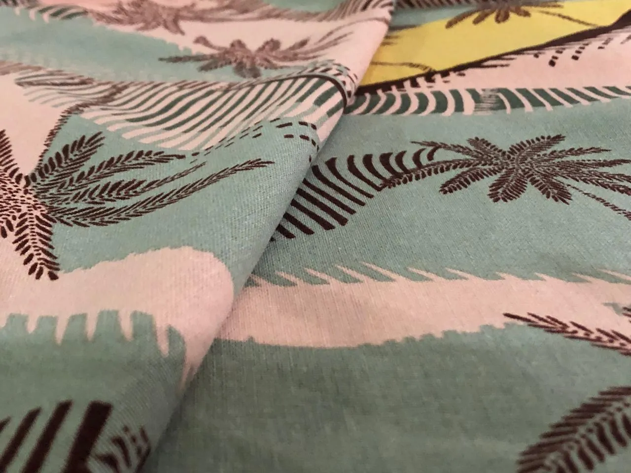 100% Cotton double cloth cotton print available in 4 different prints beach palms / blueish grey floral / pretty dainty pink orange floral AND dark ivory orange flower motif